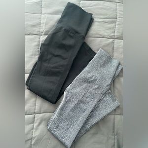Two pairs-medium womens workout leggings in black and gray.